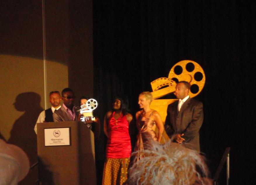 B.J. Winfrey accepting a NAFCA award on stage